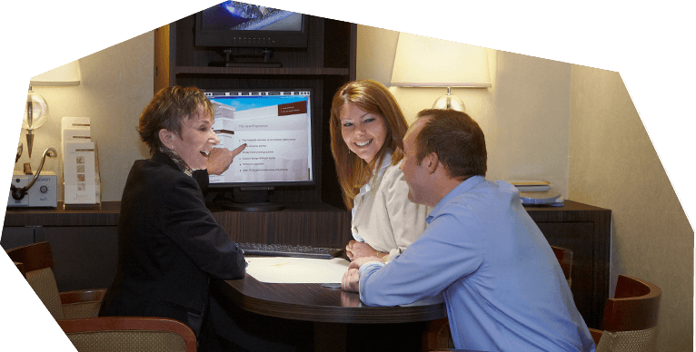 Couple Talking to Employee
